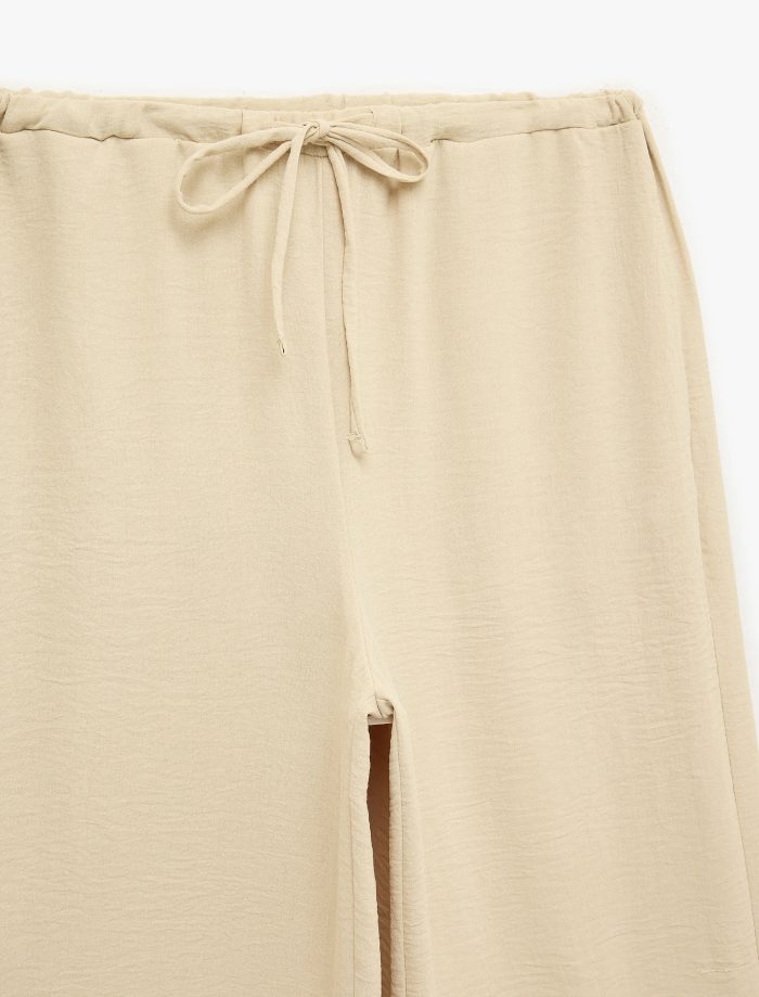 Keten Görünümlü Beli Bağcıklı Cepli Düz Geniş Paça Pantolon - Görsel 5
